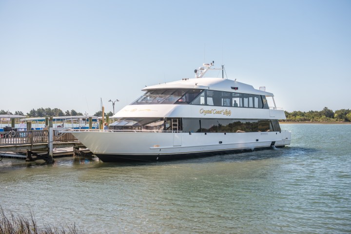 a boat is docked next to a body of water