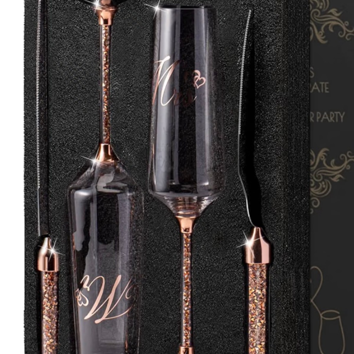 Elegant wine gift set with two glasses and two ornate knives.